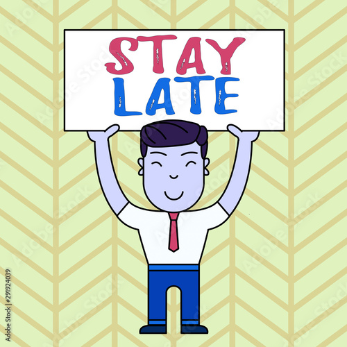 Text sign showing Stay Late. Business photo showcasing A routine in which a demonstrating goes to somewhere out of time Smiling Man Standing Holding Big Empty Placard Overhead with Both Hands photo