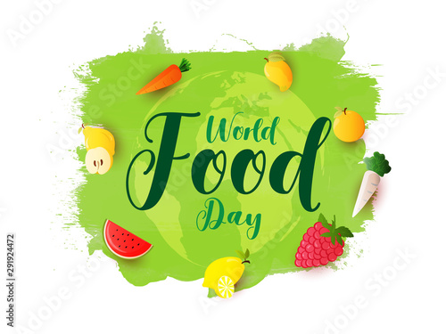 Calligraphy of World Food Day with fruits and vegetables decorated on green earth globe brush stroke background.