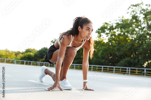 Photo of african american attractive woman doing exercise