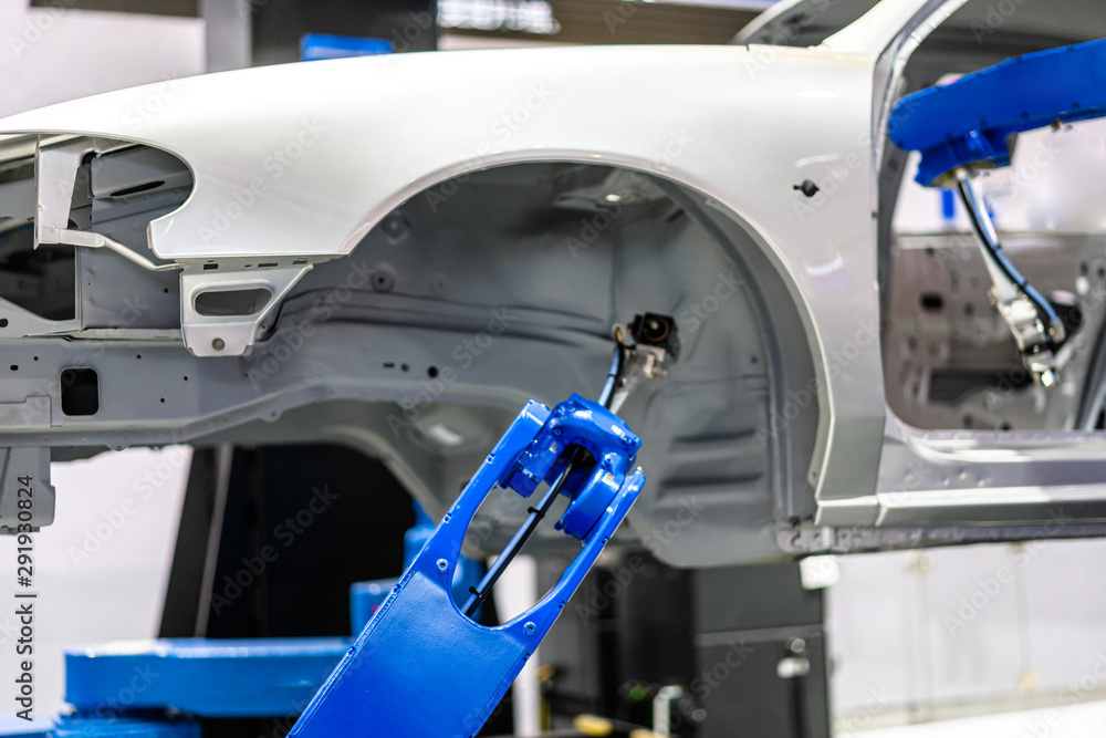 robot arm working in car factory robot arm working in car factory