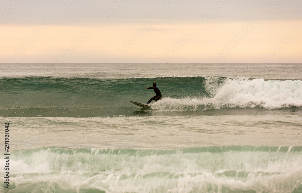 Fototapeta premium Surfer at sunset