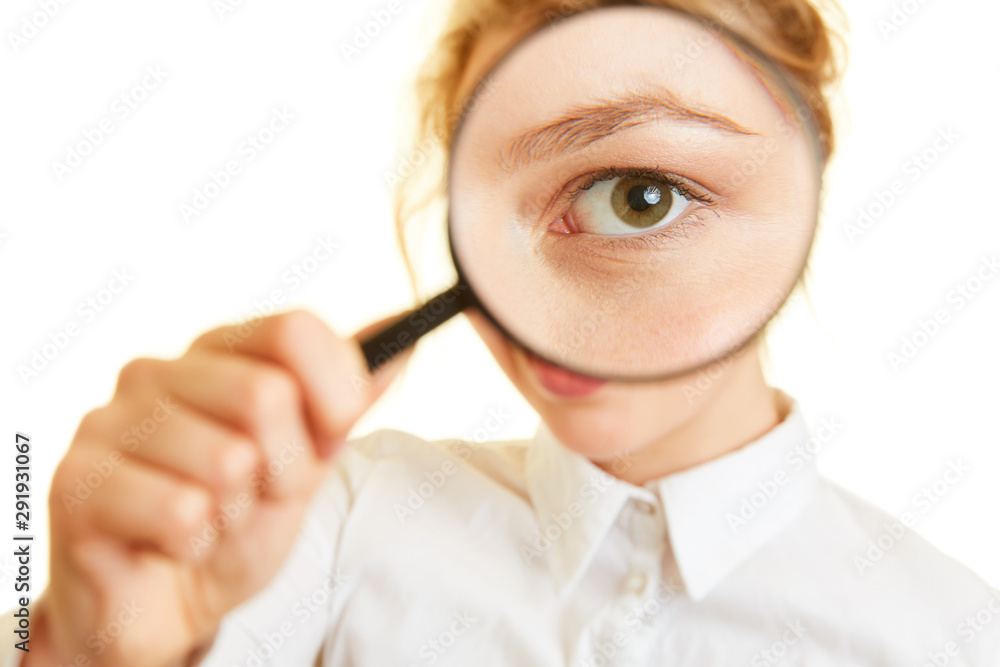 Woman looks with eye through magnifying glass to check Woman looks with eye through magnifying glass to check