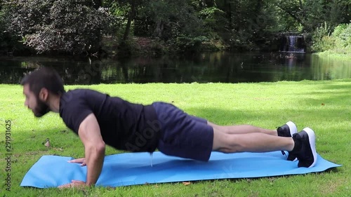 Man doing regular push ups in park