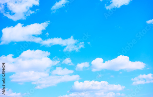 Blue sky with white heap clouds - background