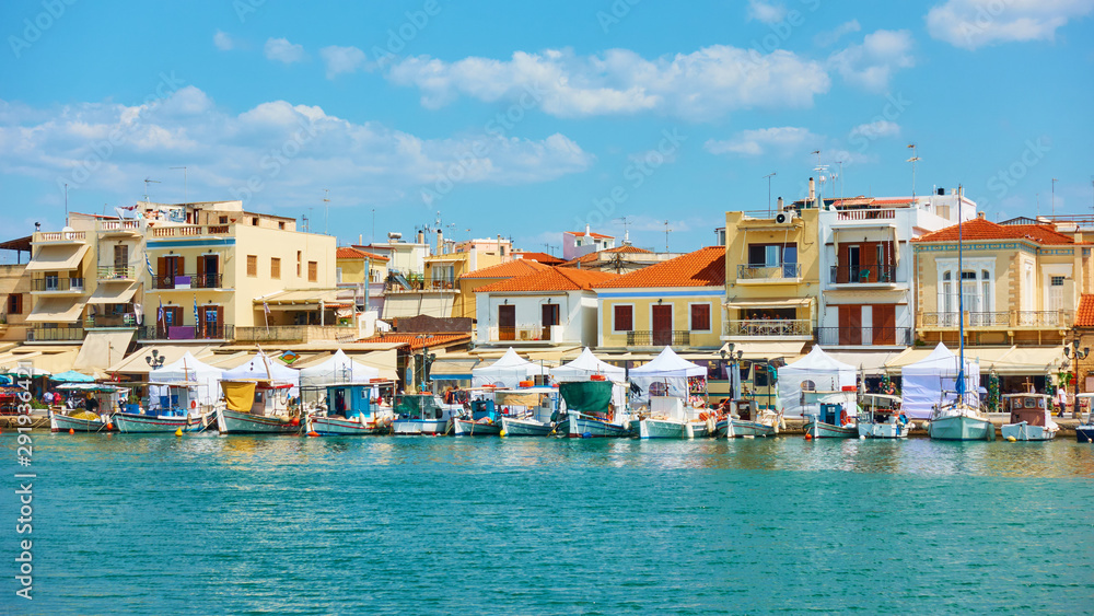 Port and waterfront with small houses in Aegina town