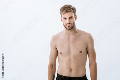 bearded shirtless sportsman looking at camera isolated on grey