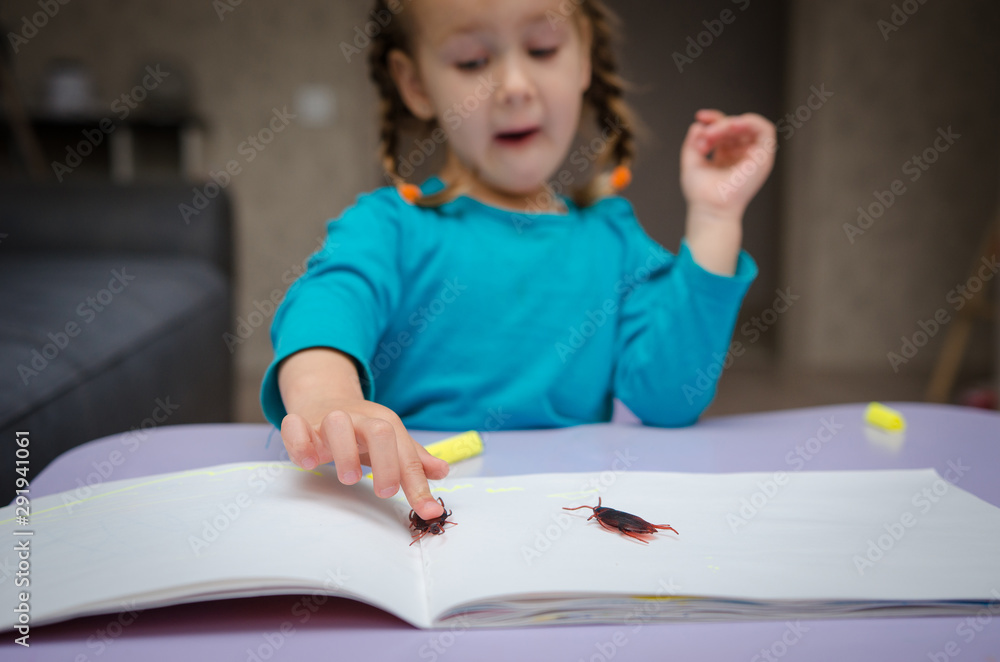 The cute little girl looking and afraid of cockroaches, Because the cockroaches are dirty and disgusting, focus on cockroaches, blur background, filter The cute little girl looking and afraid of cockroaches, Because the cockroaches are dirty and disgusting, focus on cockroaches, blur background, filter