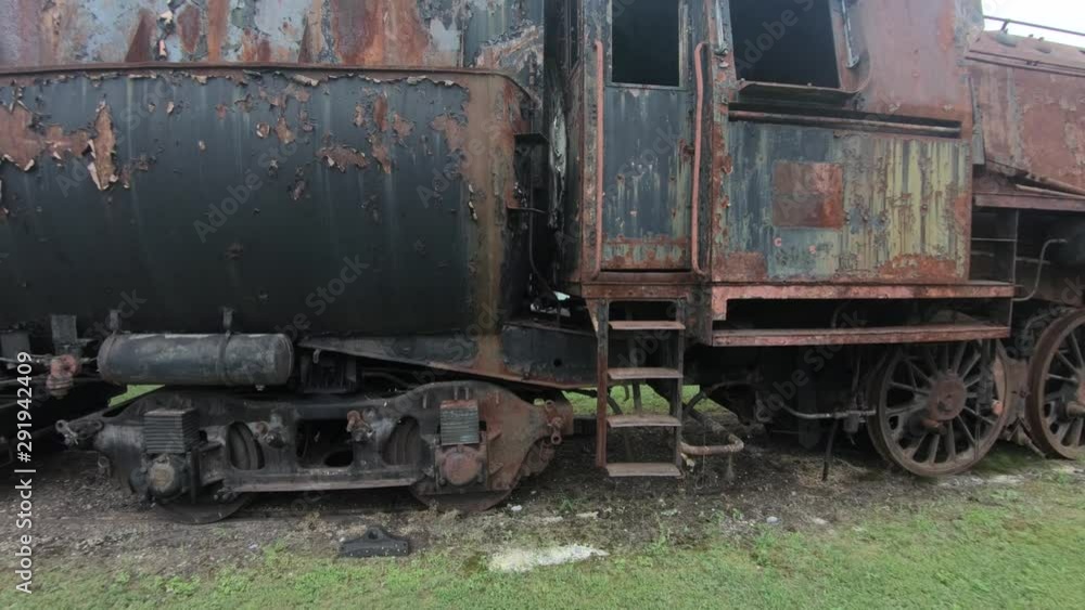 4K closeup backward reveal of rusty locomotive steel wagons 4K closeup backward reveal of rusty locomotive steel wagons