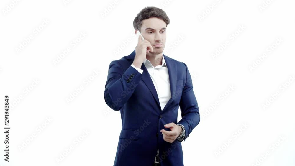 handsome young man in formal wear holding and using phone handsome young man in formal wear holding and using phone