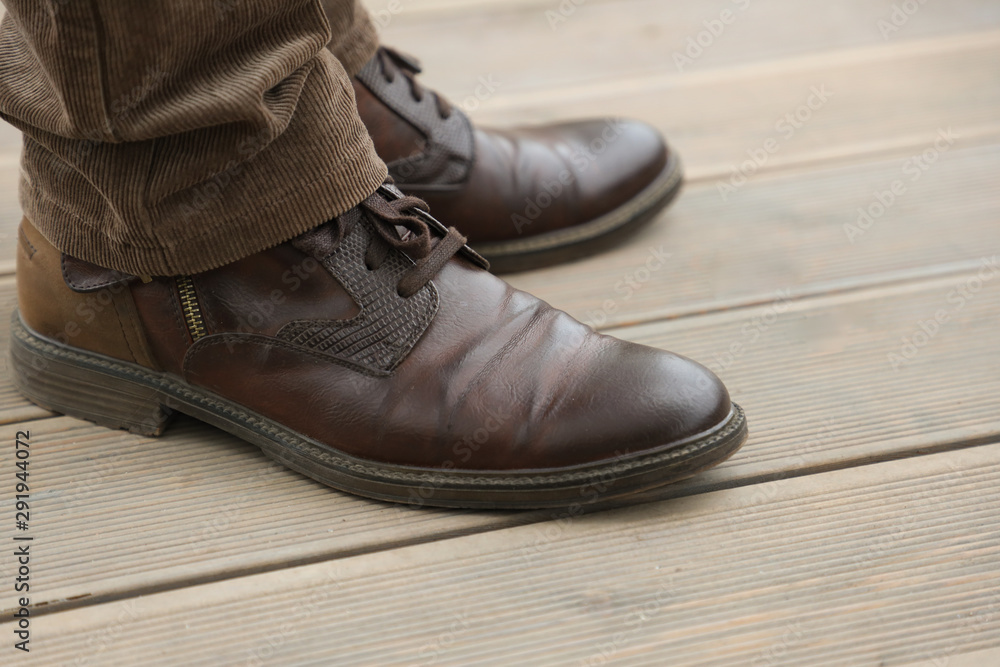 men's legs and brown boots, casual style men's legs and brown boots, casual style