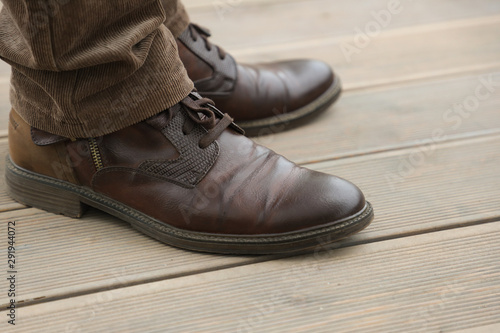 men's legs and brown boots, casual style