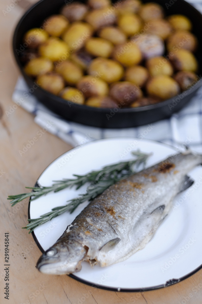 baked fish with rosemary and fried potatoes baked fish with rosemary and fried potatoes