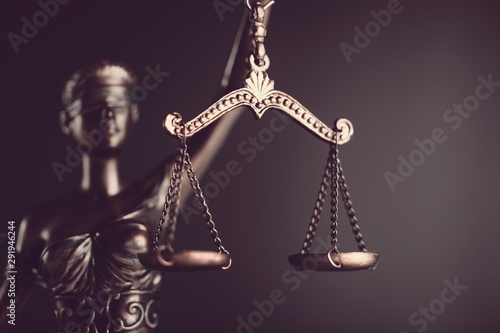 Judge hammer and house on brown wodden table and wall background