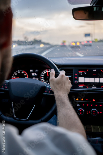 Man driving a car on road