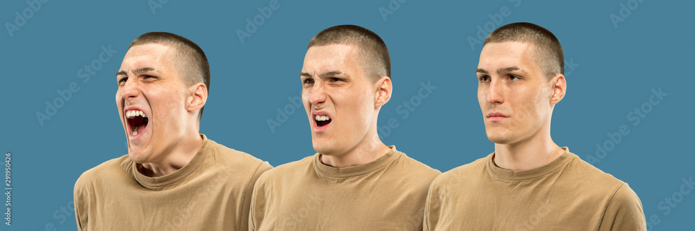 Fototapeta premium Caucasian young man's half-length portrait on blue studio background. Beautiful male model in shirt. Concept of human emotions, facial expression. Progressing angry scream from calm.