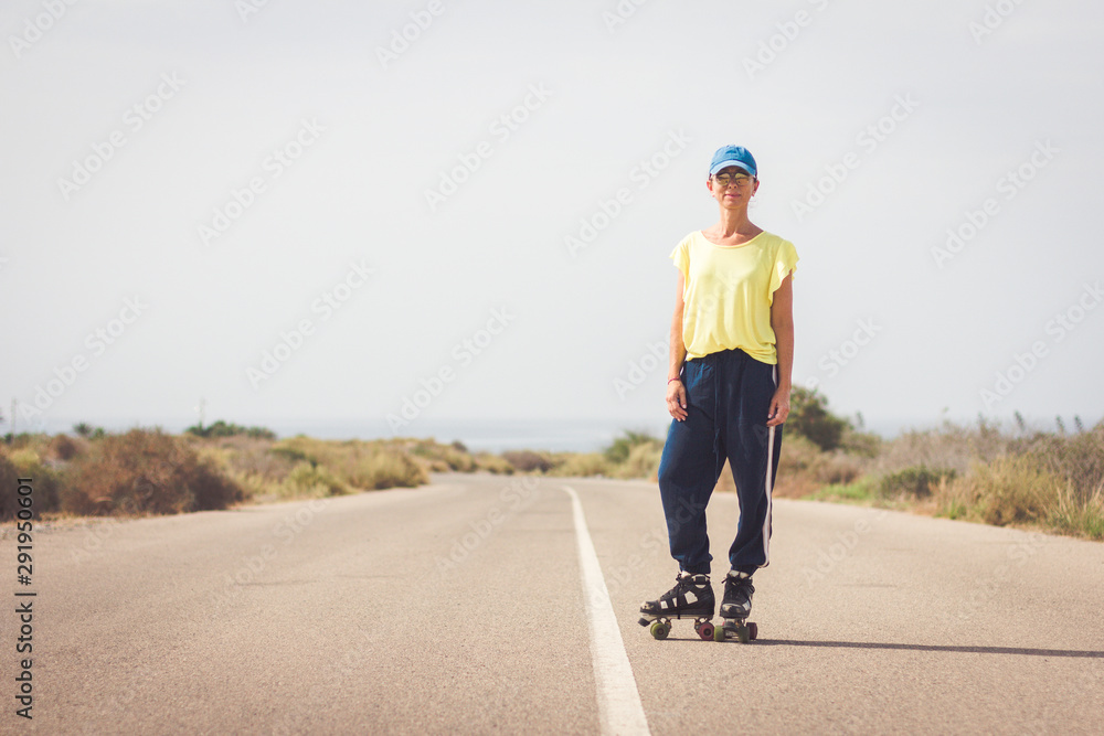 Woman skating on a lonely road in the desert