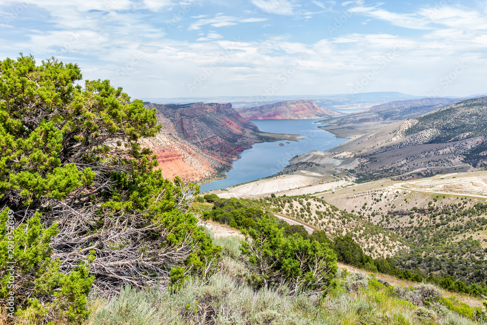 Panoramic view of Sheep Creek Overlook and bush in Manila, Utah near Flaming Gorge National Park with cloudy valley and river