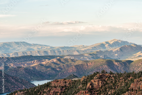 Aerial view from Canyon Rim trail overlook near campground in Flaming Gorge Utah National Park with Green River at sunset