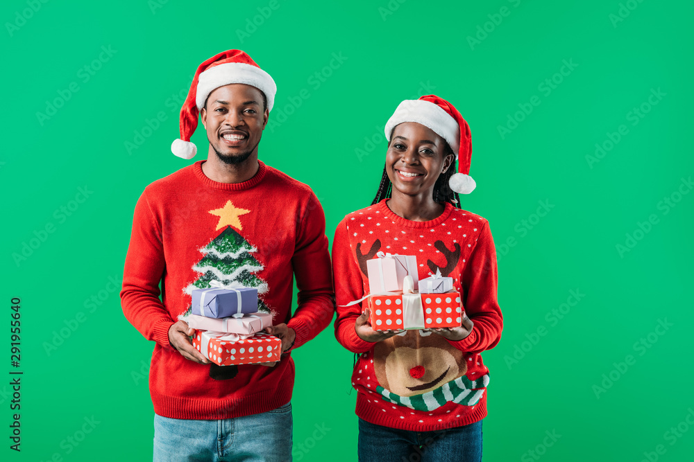 Santa hats holding presents 