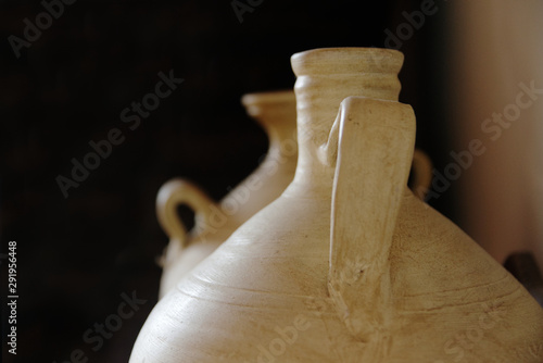 Clay water jug and pitcher botijos in Andalusia, Spain. Travel background with empty copy space for Editor's text. photo