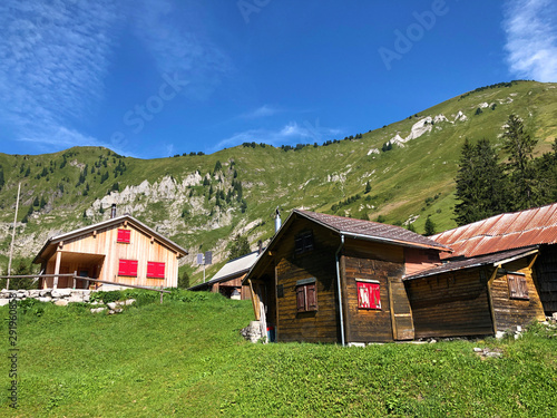 The Alpine village of Vorder Ahornenin in a Oberseetal mountain valley and in the Glarnerland tourist region, Nafels (Näfels or Naefels) - Canton of Glarus, Switzerland photo