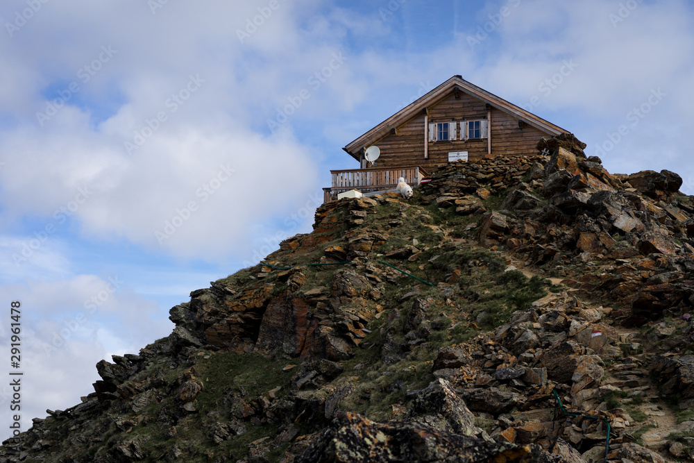 A beautiful house on the top of a mountain.