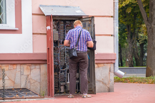 Wallpaper Mural The master repairs the telephone exchange Torontodigital.ca