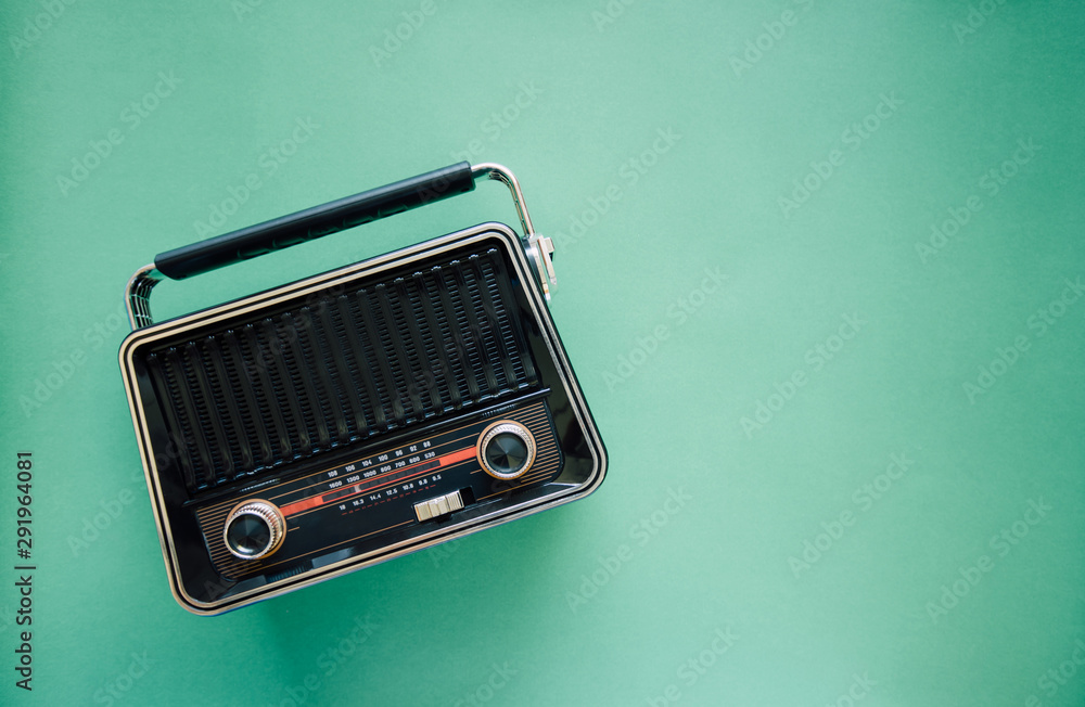 Retro style old boombox radio from 1950s, 1960s on green pastel paper  background and Vintage tone instagram style filter photo Stock Photo |  Adobe Stock