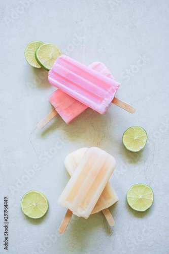 yellow colorful fruity with lemon slice ice cream stick on white marble background.