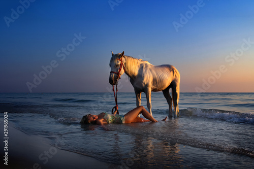Woman on beach with horse © Peter Hofstetter