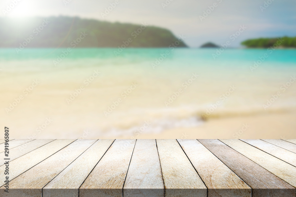 Wood table on blurred beach background. Wood table on blurred beach background.