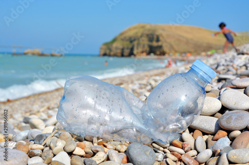 Plastic bottle pollution on a beach.