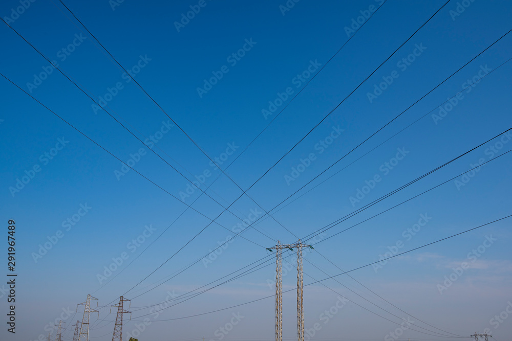 industrial landscape of high voltage pylons