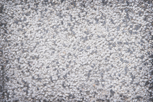 Exposed aggregate concrete wall texture or white gray and black terrazzo stone background