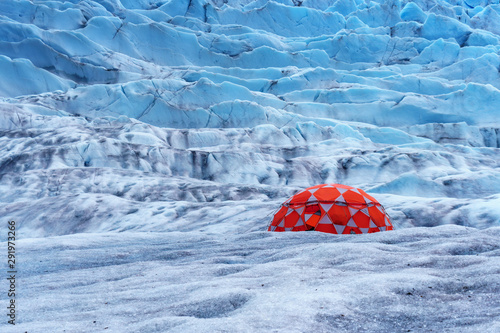 Red tent on the glacier. Excursion by helicopter in Juneau, Alaska. Extended glacier trek is hiking and ice climbing. Camp is located on top of the mountain. Life changing experience. 