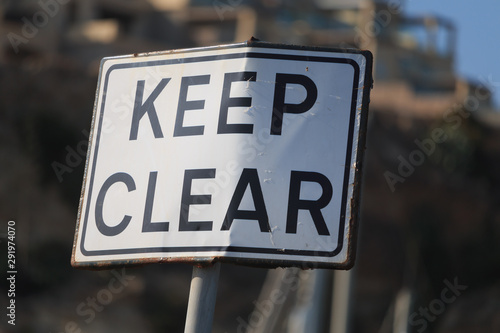 Keep clear road sign on blur background, horizontal