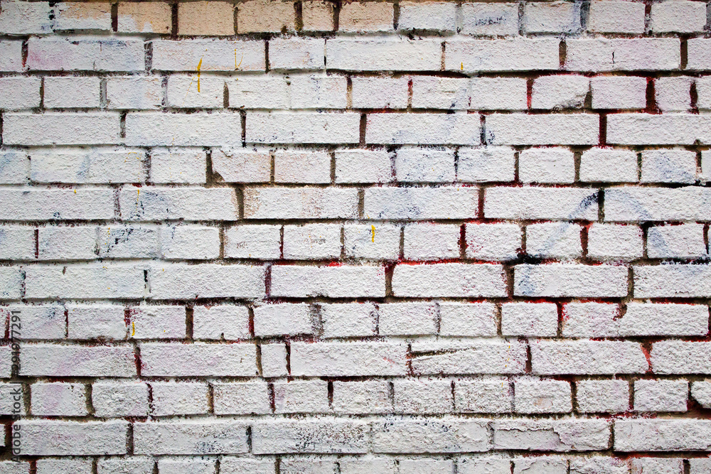 white bricks loft style wall with colorful spots white bricks loft style wall with colorful spots