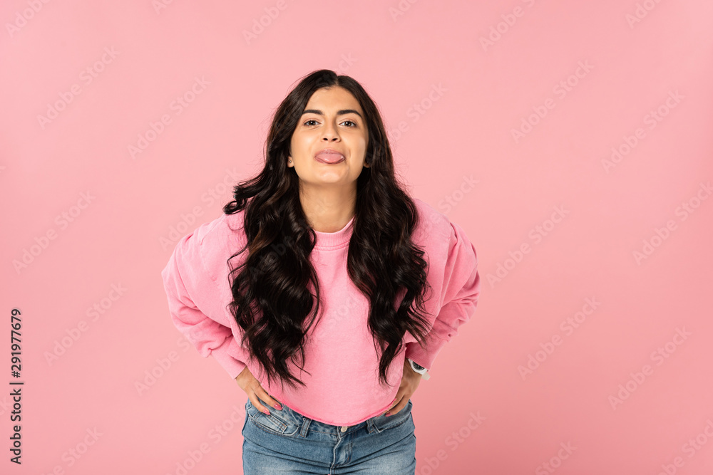 attractive girl sticking tongue out isolated on pink attractive girl sticking tongue out isolated on pink