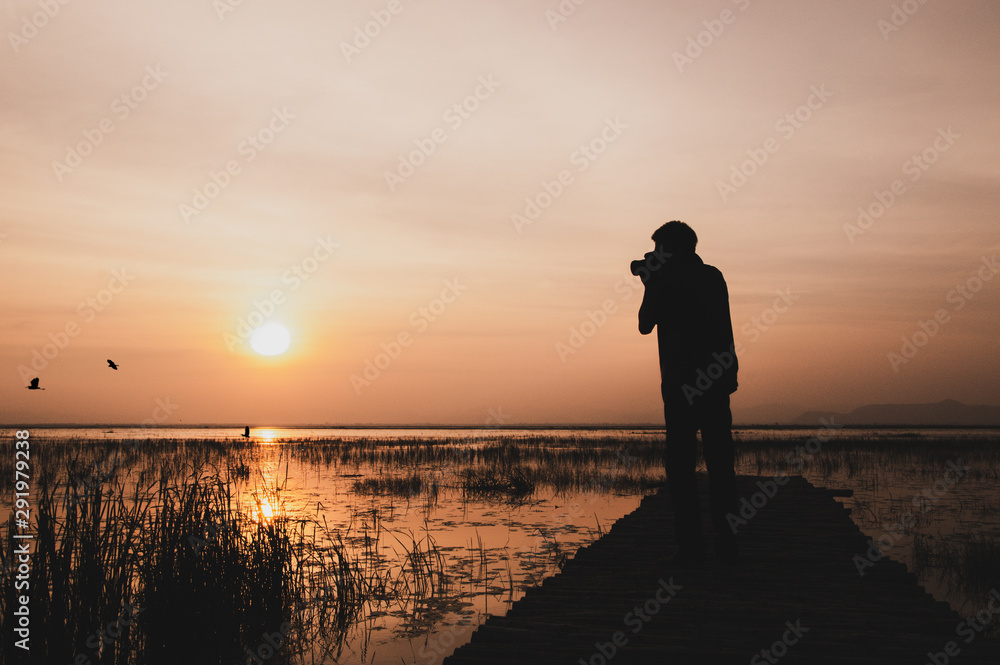 Fototapeta premium A man standing on a bridge