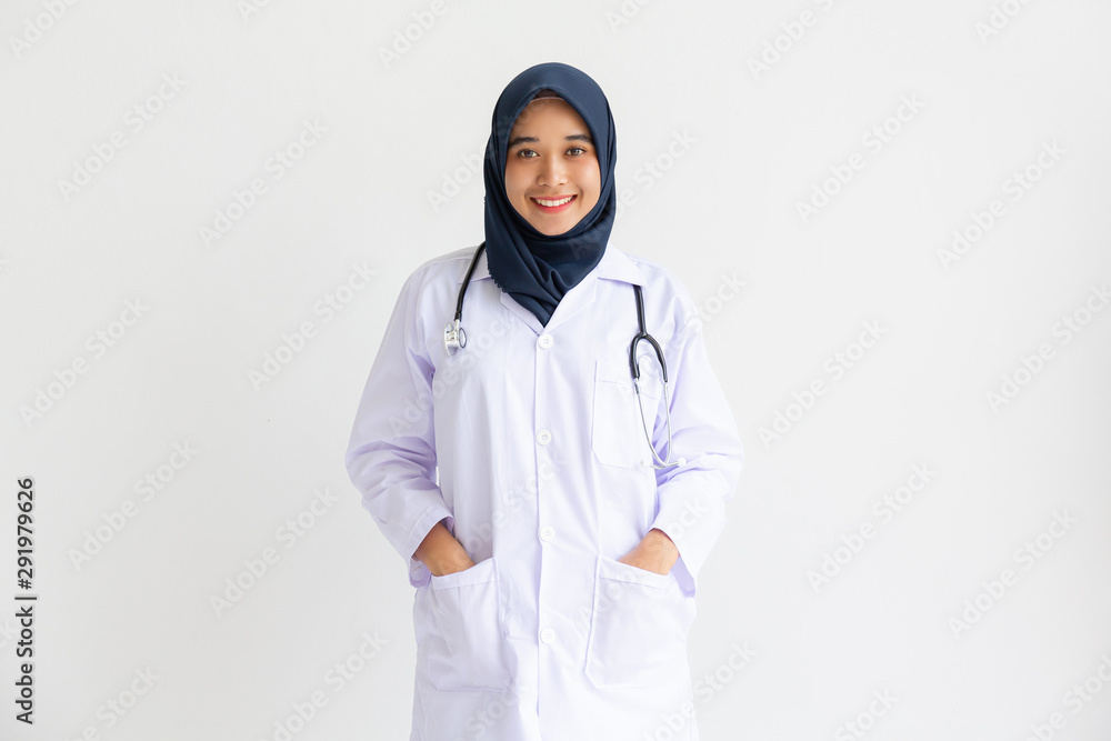 Young Arab Muslim intern doctor women smile on isolate white background concept for Islam people working in medical hospital health care, Modern Nurse wearing hijab in medico clinic business service. Young Arab Muslim intern doctor women smile on isolate white background concept for Islam people working in medical hospital health care, Modern Nurse wearing hijab in medico clinic business service.