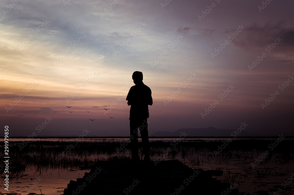 A man standing on a bridge A man standing on a bridge