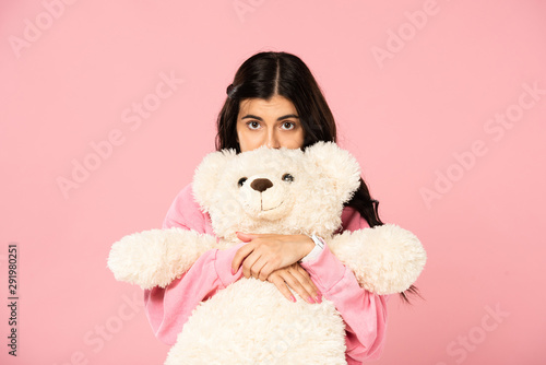 beautiful cheerful woman hugging teddy bear, Isolated On pink