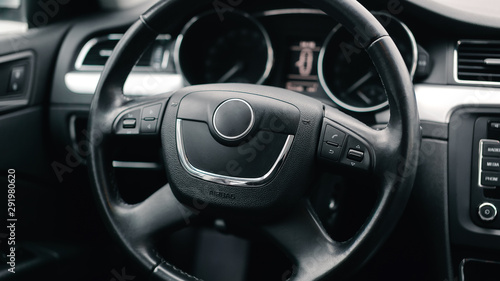 Interior car. Black steering wheel of the car.