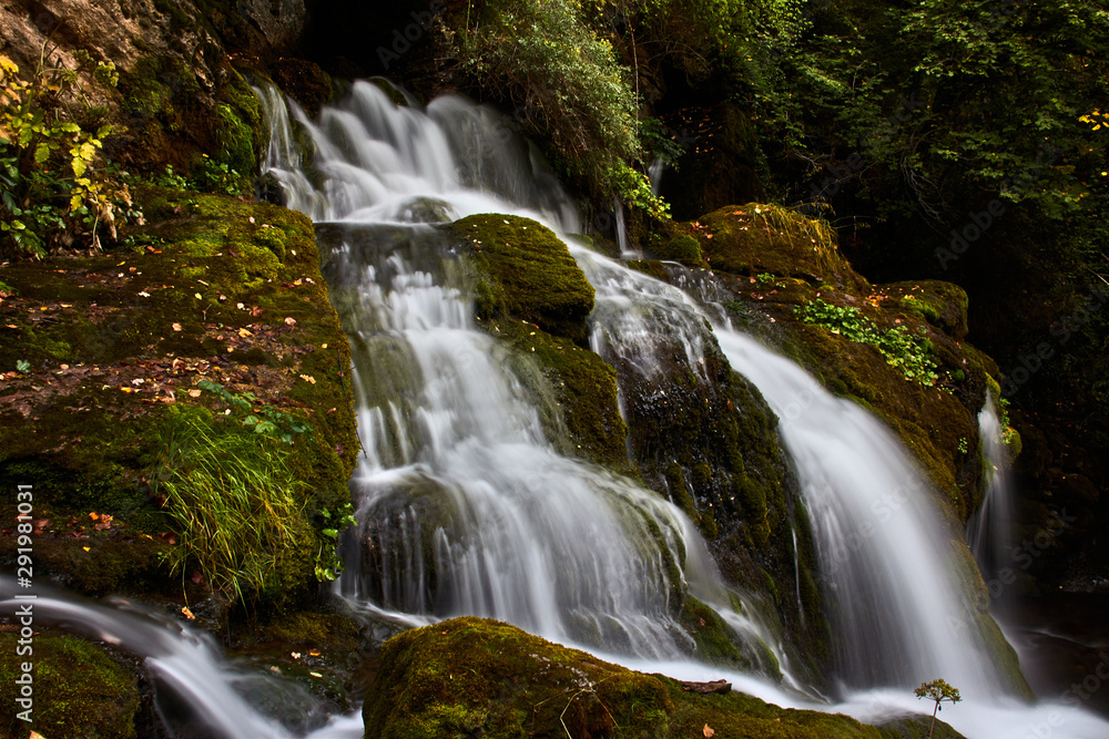 Fototapeta premium Water cascade between the rocks of a river