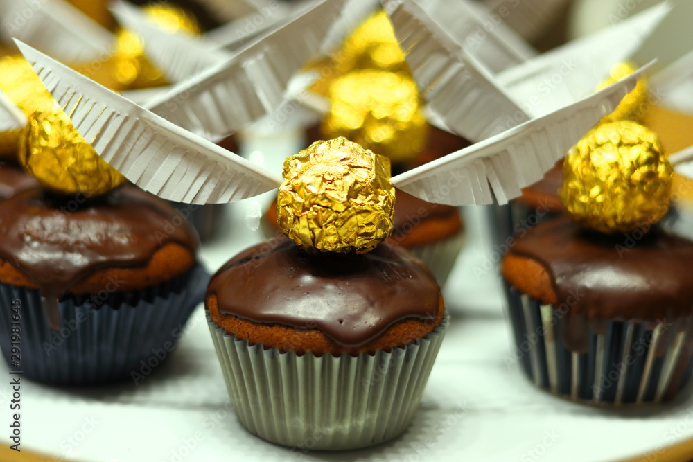 Fototapeta premium Muffins with snitch (Harry Potter Theme) decoration.