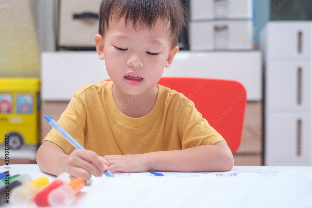Cute Asian 3 - 4 years old toddler boy child writing / drawing with pencil, Student doing homework, Little kid prepare for kindergarten test, Creative play for toddler, improve focus in child concept Cute Asian 3 - 4 years old toddler boy child writing / drawing with pencil, Student doing homework, Little kid prepare for kindergarten test, Creative play for toddler, improve focus in child concept