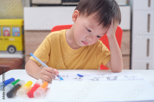 Cute Asian 3 - 4 years old toddler boy child writing / drawing with pencil, Student doing homework, Little kid prepare for kindergarten test, Creative play for toddler, improve focus in child concept