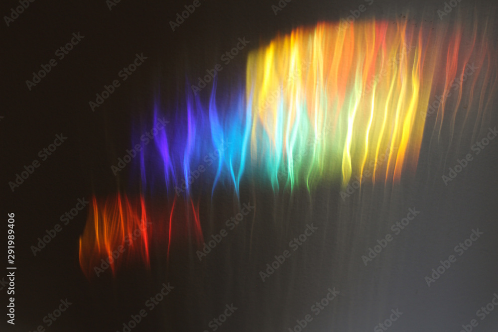Rainbow colored light reflections in cool wave pattern