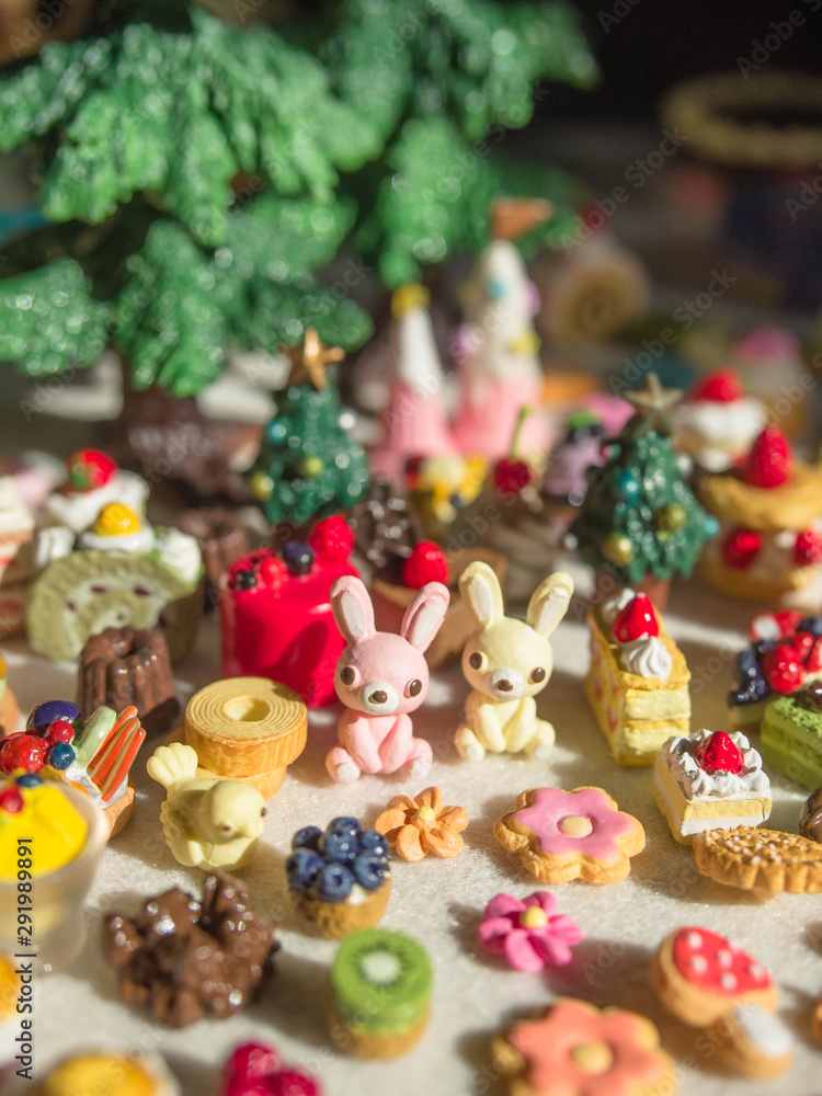 Obraz premium Merry Chrismas with a lot of miniature toys. Sweet party, dessert table toy concept.