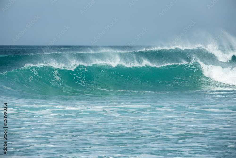 Rolling turquoise surf breaks at Fistral beach in Cornwall Rolling turquoise surf breaks at Fistral beach in Cornwall